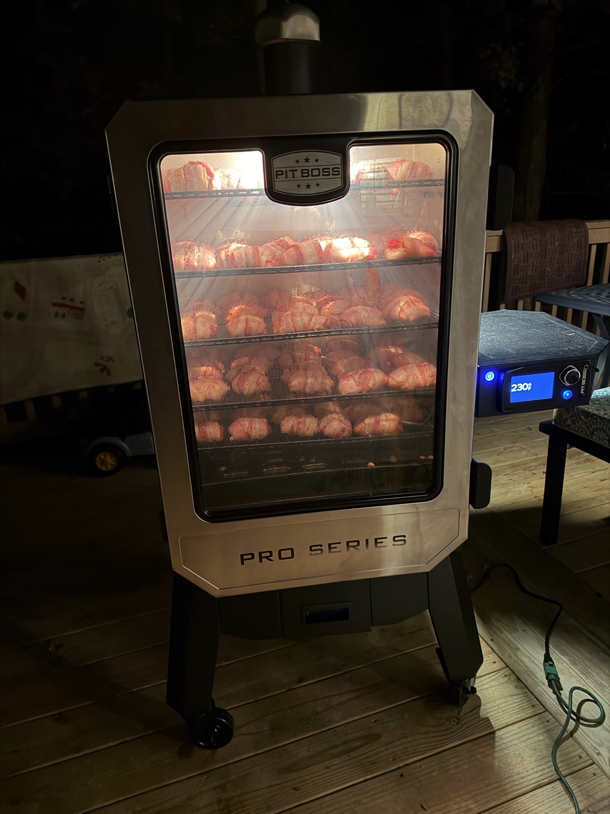 Pit Boss smoker packed full — smoking all night